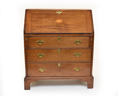 Lot 591 - A George III oak bureau