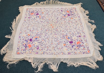 Lot 512 - A 19th century embroidered silk shawl