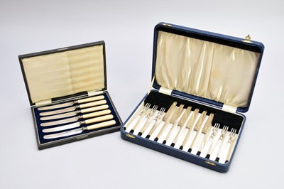 Lot 224 - A cased set of twelve silver fruit knives and forks