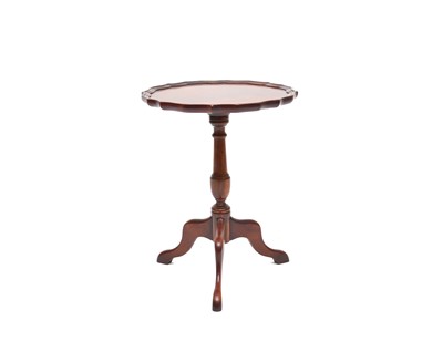 Lot 789 - A reproduction mahogany 'pie crust' wine table by Charles Barr