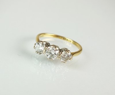 Lot 64 - A graduated three stone diamond ring