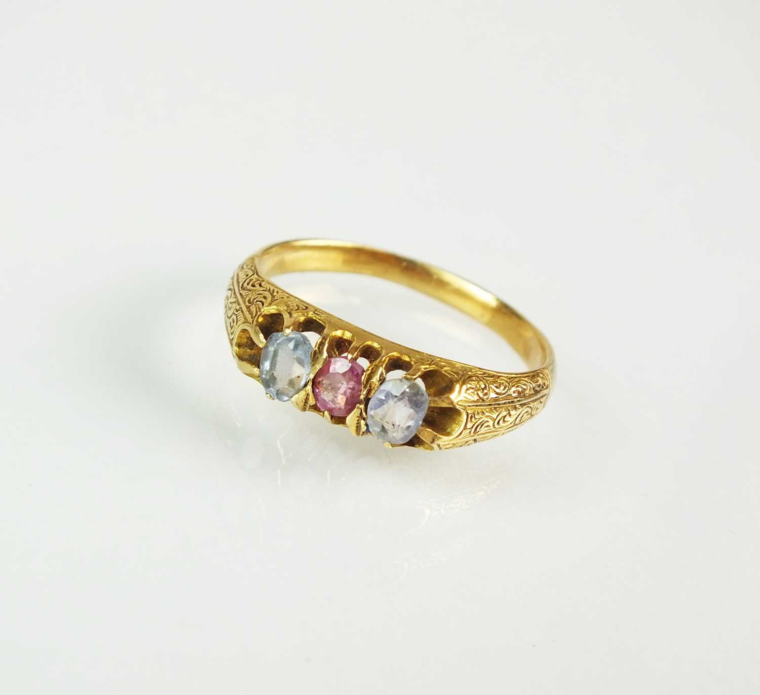 Lot 74 - A 19th century three stone sapphire and ruby ring