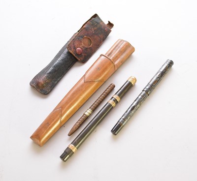 Lot 502 - Two fountain pens, a pencil and a penner