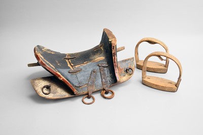 Lot 455 - A Himalayan lacquered hardwood saddle, Qing Dynasty