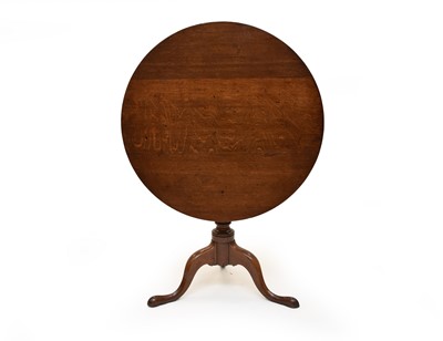 Lot 595 - A George III oak tilt-top tripod table