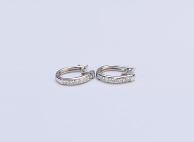 Lot 140 - A pair of platinum diamond earrings