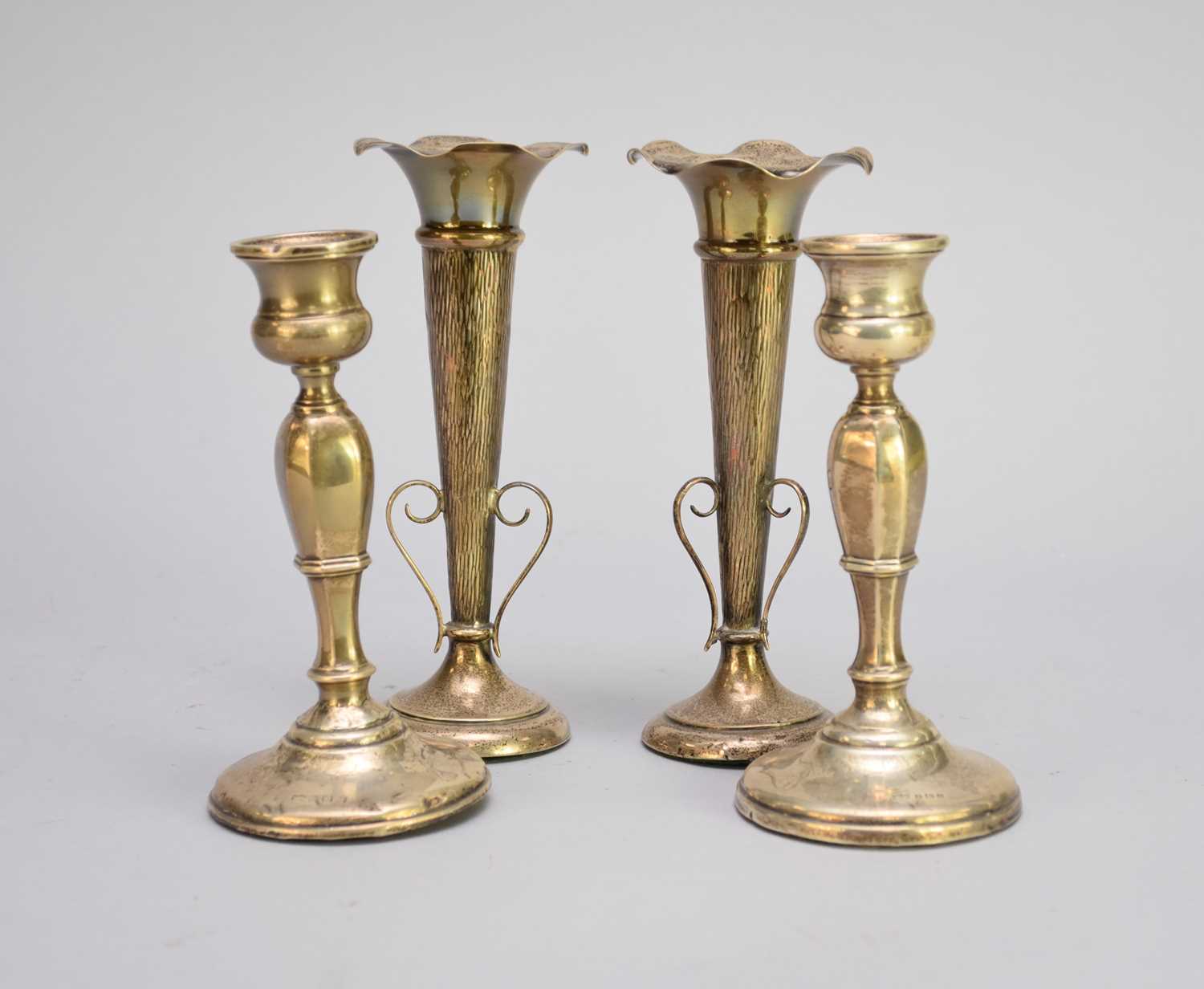Lot 9 - A pair of silver mounted posy vases and a pair of silver mounted candlesticks
