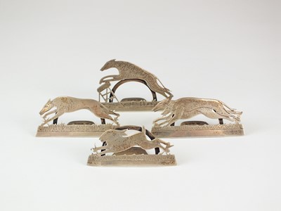 Lot 11 - A set of four novelty silver menu holders in the form of greyhounds and a hare