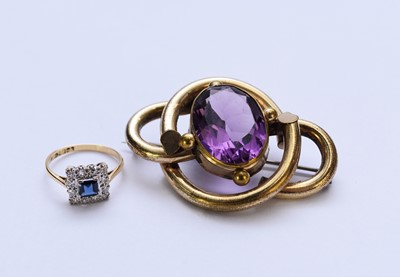 Lot 135 - An 18ct gold sapphire and diamond ring and a paste brooch