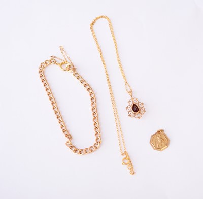 Lot 136 - A 9ct gold bracelet, a garnet necklace and a St Christophers pendant