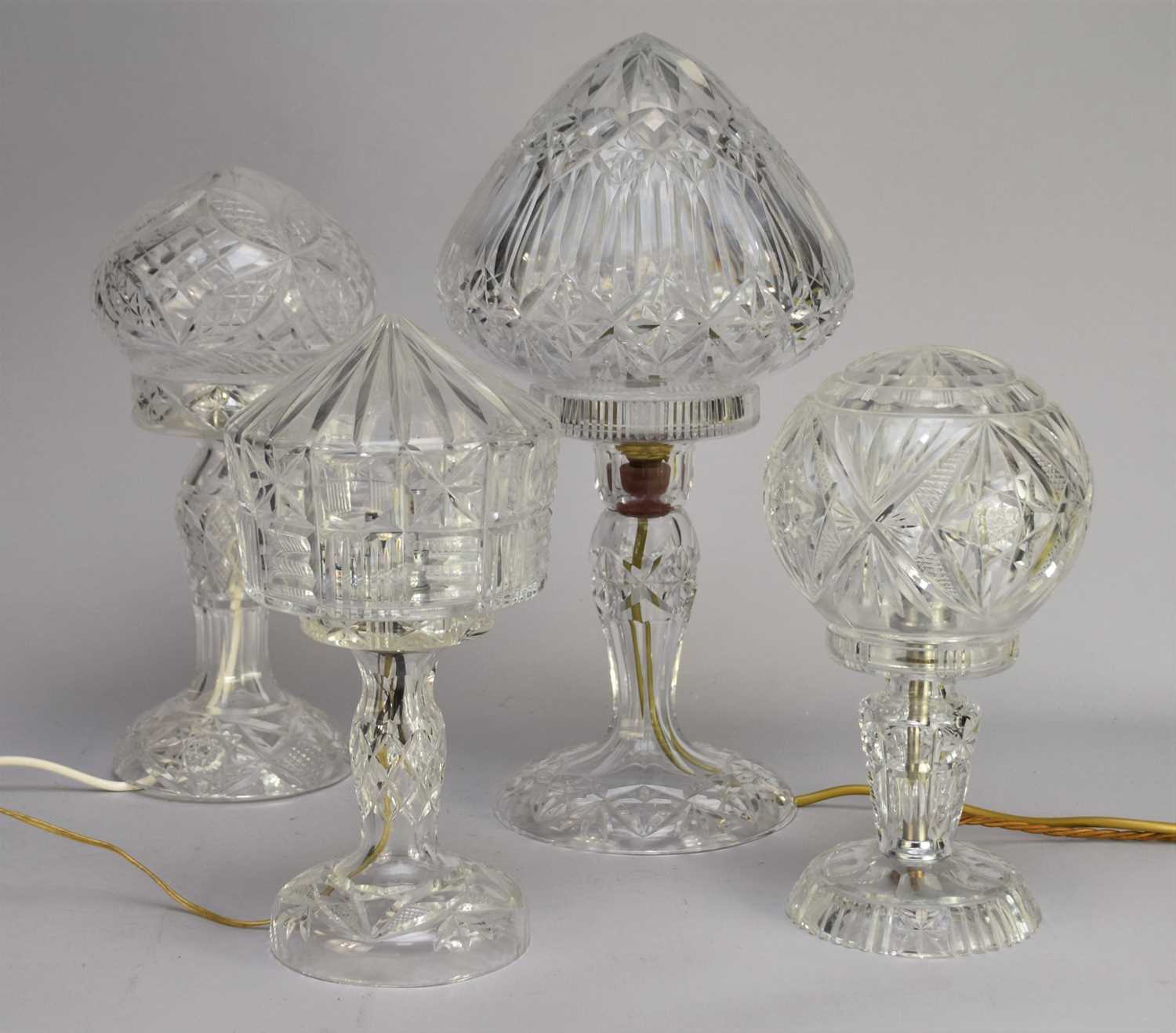 Lot 542 - Four various cut glass table lamps, 20th century