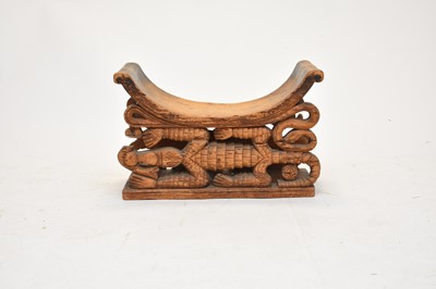 Lot 482 - An Asanti tribal carved wood stool, 19th century