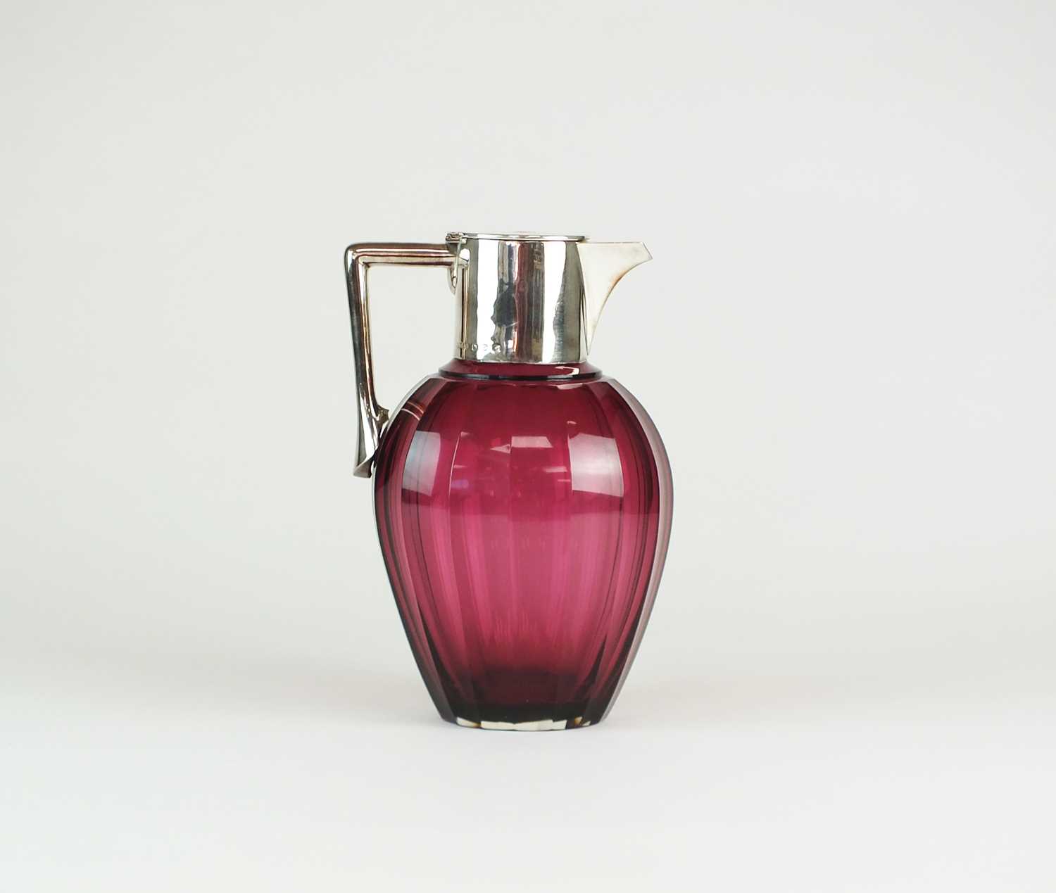 Lot 5 - A Victorian silver mounted cranberry glass claret jug
