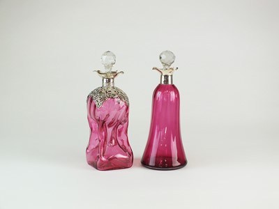 Lot 7 - Two silver mounted cranberry glass decanters