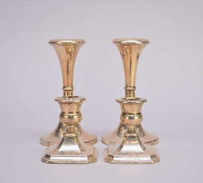 Lot 33 - Two pairs of silver mounted candlesticks