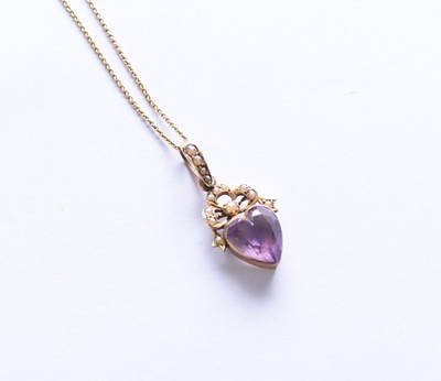 Lot 137 - A heart shaped amethyst and seed pearl set pendant