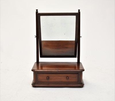 Lot 630 - A Victorian mahogany toilet mirror and an oval wall mirror