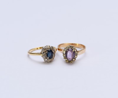 Lot 125 - A sapphire and diamond oval cluster ring and an amethyst cluster ring