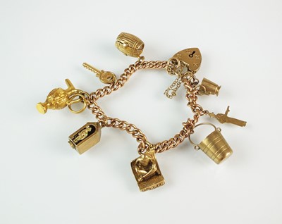 Lot 55 - A 9ct gold charm bracelet