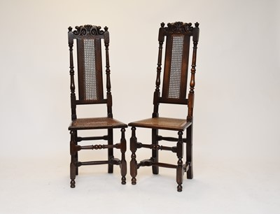 Lot 551 - A pair of Flemish style oak cane seated chairs
