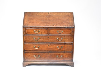 Lot 570 - A George III oak bureau