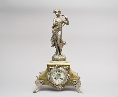 Lot 523 - A French figural mantel clock