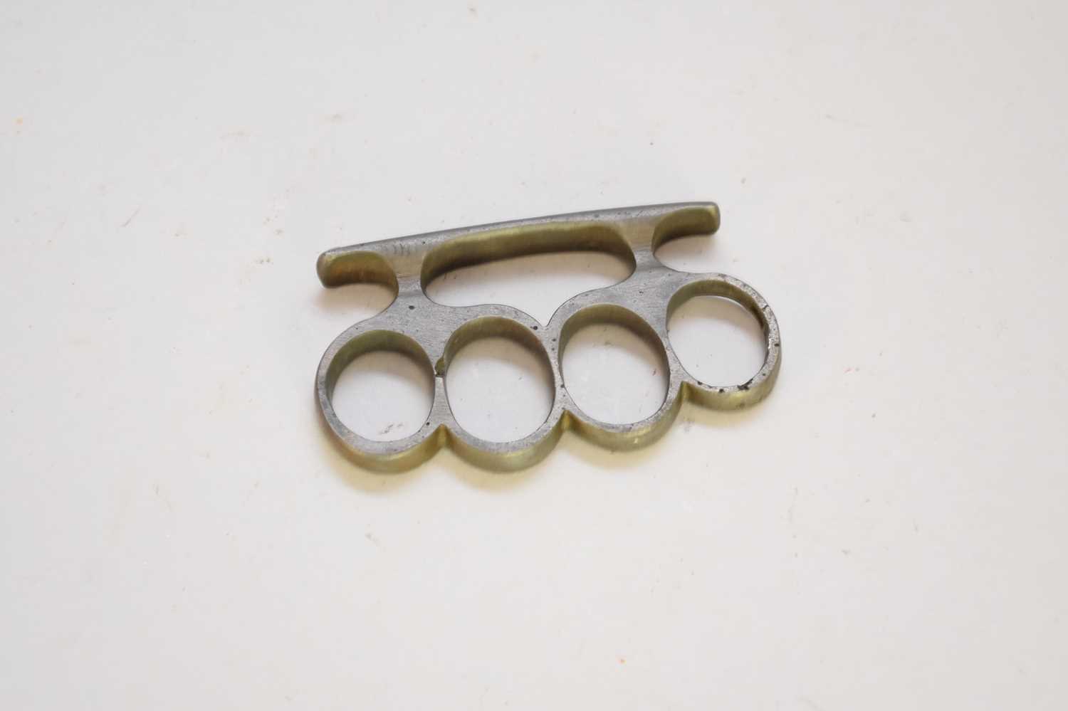 Lot 457 - An early 20th-century steel knuckle duster, of...