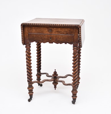 Lot 561 - A 19th century walnut work table