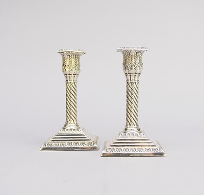 Lot 55 - A pair of Victorian silver mounted candlesticks