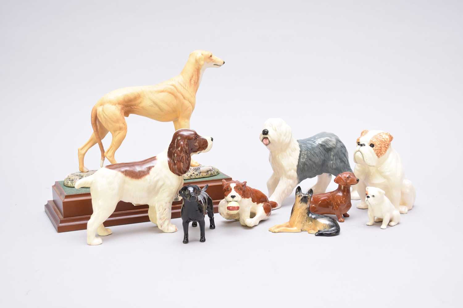 Lot 398 - Royal Doulton 'Mick the Miller' and Beswick dogs