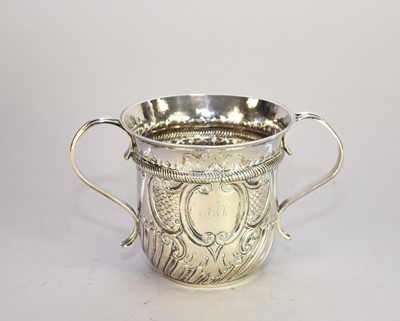 Lot 66 - A George II silver two handled porringer