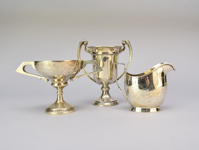 Lot 67 - Two silver trophy cups and a silver cream jug