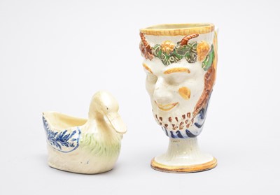 Lot 313 - English pearlware duck sauceboat and a Bacchus mug