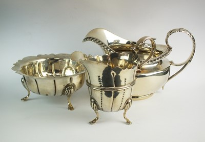 Lot 71 - An Irish silver cream boat and sugar bowl and a further silver cream jug