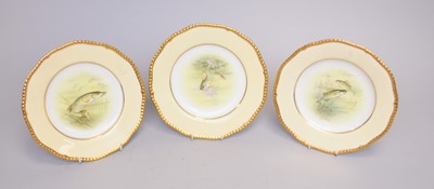 Lot 290 - Three Coalport plates decorated with fish by Percy Simpson
