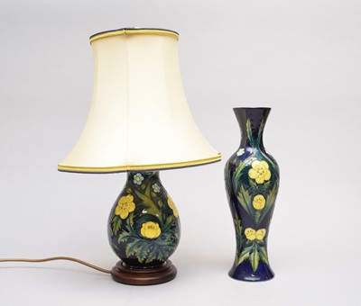 Lot 364 - A Moorcroft 'Buttercup' pattern table lamp and vase