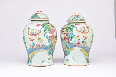 Lot 34 - A pair of Chinese Famille Rose vases and covers