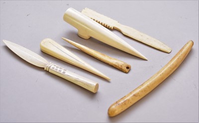 Lot 465 - Six North American Inuit carved tools in bone and ivory