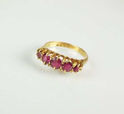 Lot 36 - An 18ct gold five stone ruby ring