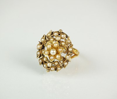 Lot 131 - A seed pearl set ring