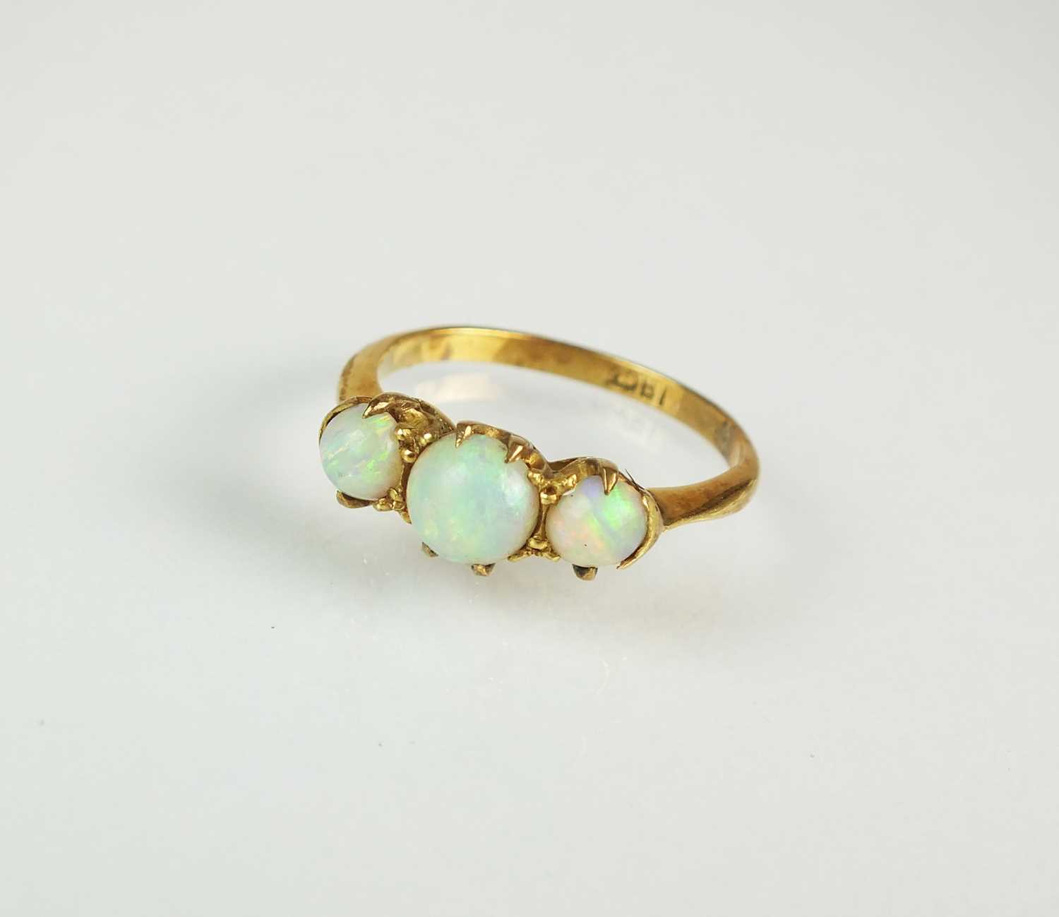 Lot 91 - A graduated three stone opal ring