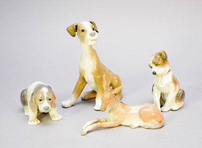 Lot 412 - Three Lladro dogs and a Lladro donkey