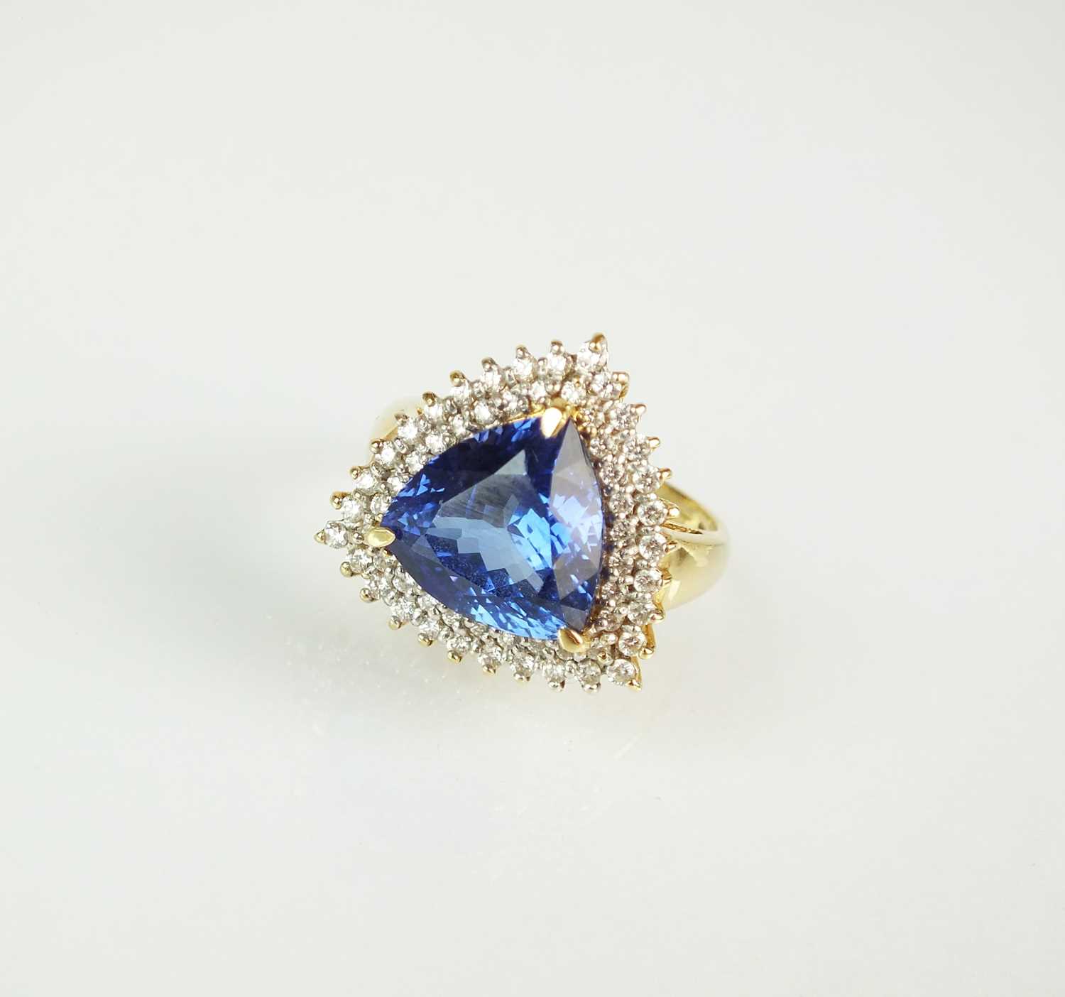 Lot 68 - An 18ct gold tanzanite and diamond cluster ring