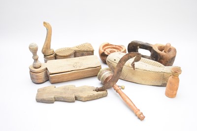 Lot 396 - A collection of Tibetan wooden boxes and implements