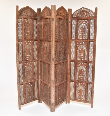 Lot 398 - An Indian carved wood four fold room screen