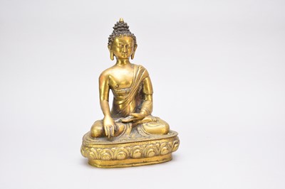 Lot 400 - A Sino Tibetan bronze seated Buddha