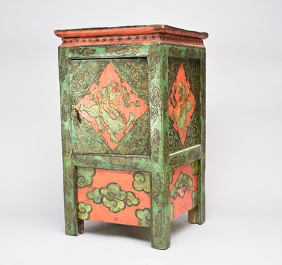 Lot 401 - A Tibetan polychrome lacquered small cabinet
