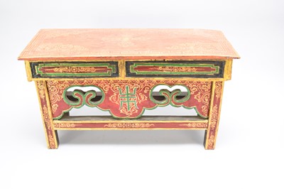 Lot 408 - A Tibetan polychrome lacquer stool and a small curio chest