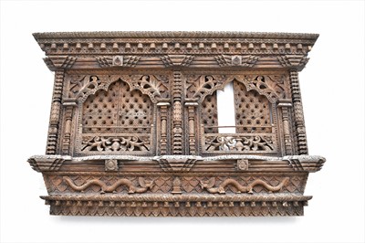 Lot 429 - A Tibetan carved wood window and cresting