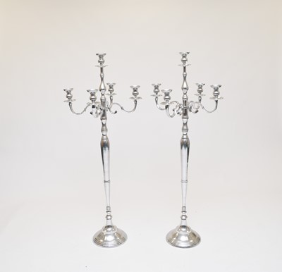 Lot 496 - Two pairs of four branch polished steel floor candelabra